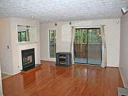 GREAT ROOM WITH HARDWOOD FLOORS, FIREPLACE W/GAS LOGS AND PATIO DOOR 