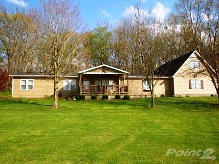 Welcome Home! This 4 bedroom ranch sits on nearly 4 acres and offers country living with modern amenities.  Many upgrades have been made including a new front porch, a poured driveway, game & exercise rooms and an above ground pool for those warm summer days!