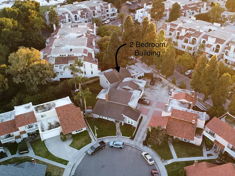 Aerial view of property showing the end of the cul-de-sac and two bedroom unit is in a seprate free standing building
