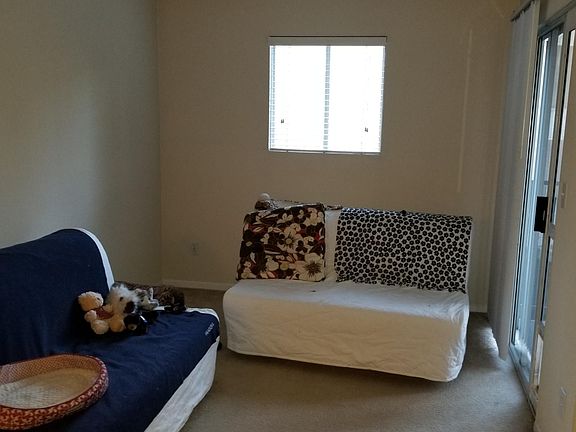 spacious living room with sliding door to balcony