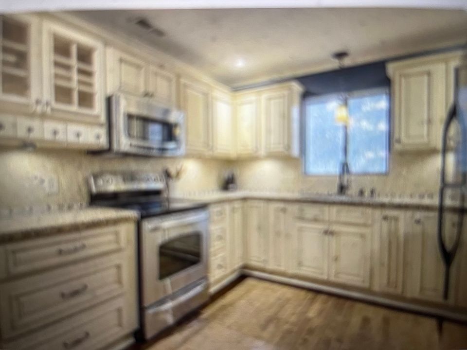 Updated Kitchen w/ granite countertops and stainless steel appliances!