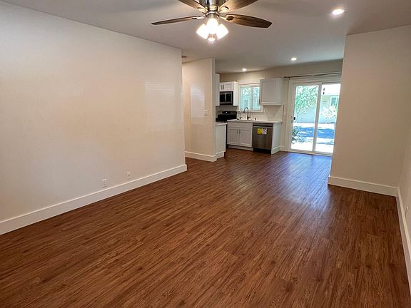 View from just inside the front door. Standing in the living room looking towards the kitchen.
