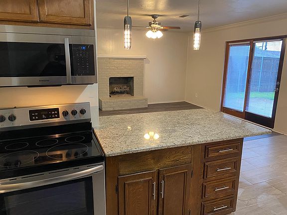 Kitchen bar area overlooking patio and back yard