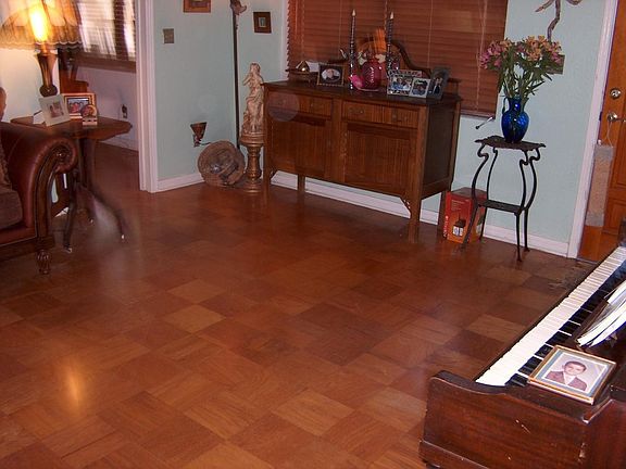 living room (hardwood floors and wood blinds)