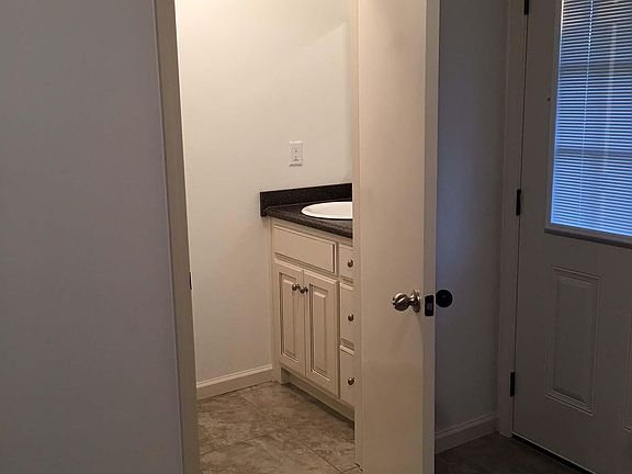 Downstairs half-bath view from kitchen