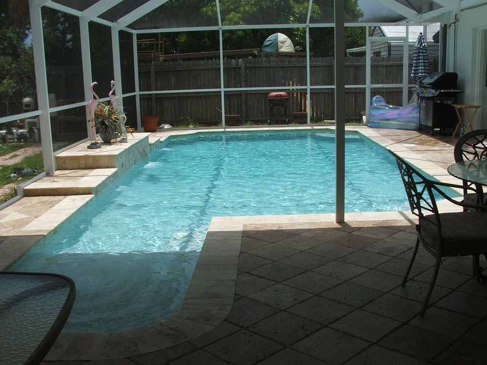 Screened inground pool with 3 water falls