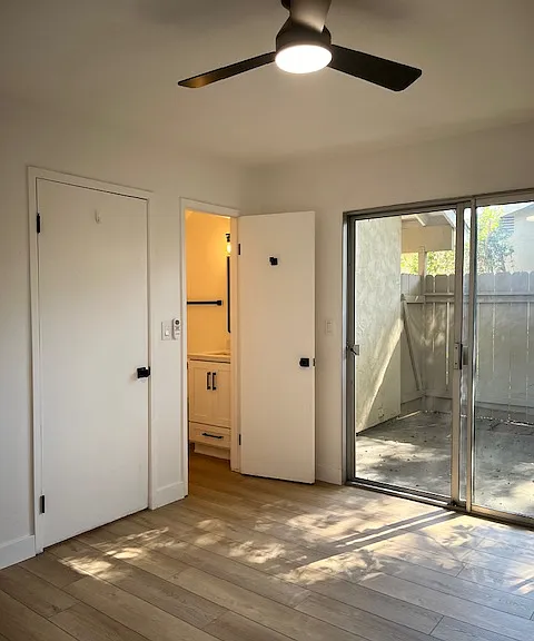 Main floor bedroom with XL closet and direct access to half bath as well as outdoor patio