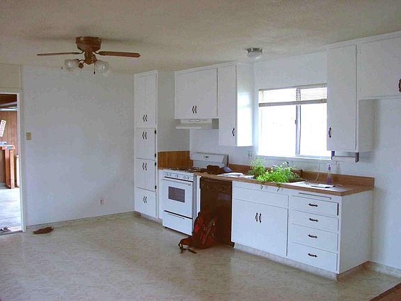 Kitchen with peek into garage