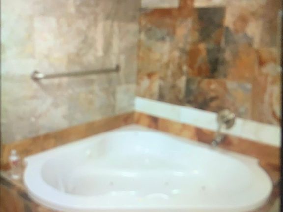 1 bathroom. Beautiful tile work jacuzzi bathtub & shower