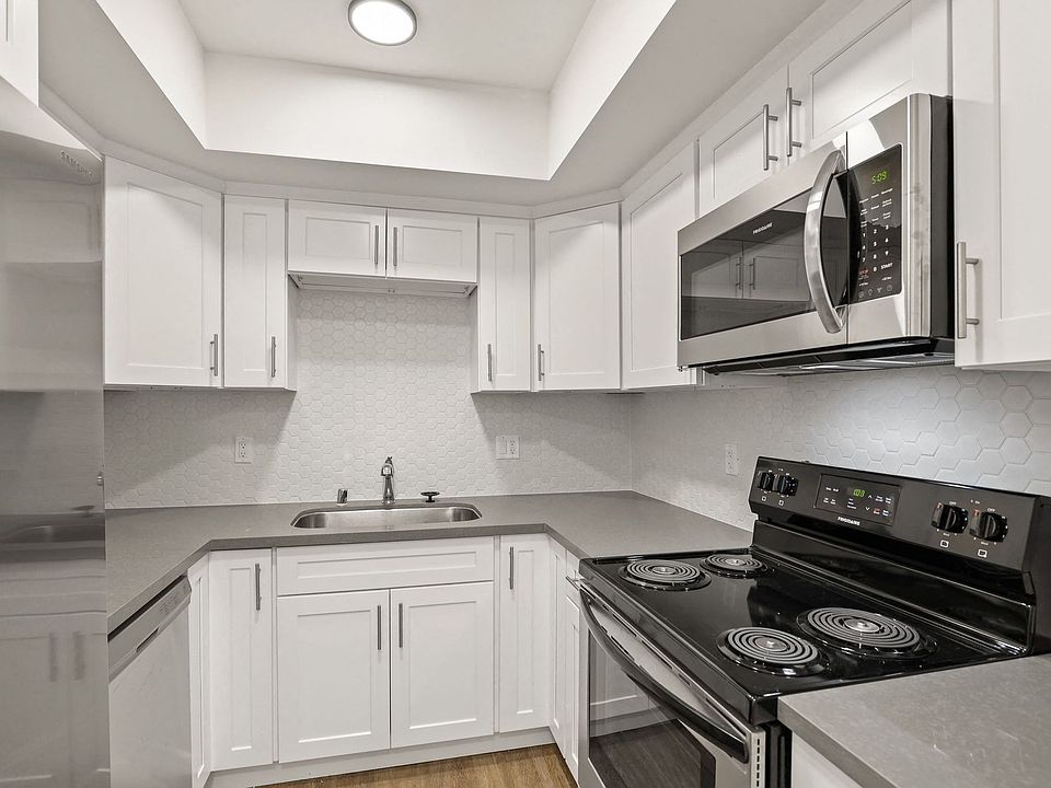 Kitchen with Stainless-Steel Stove and Microwave Oven