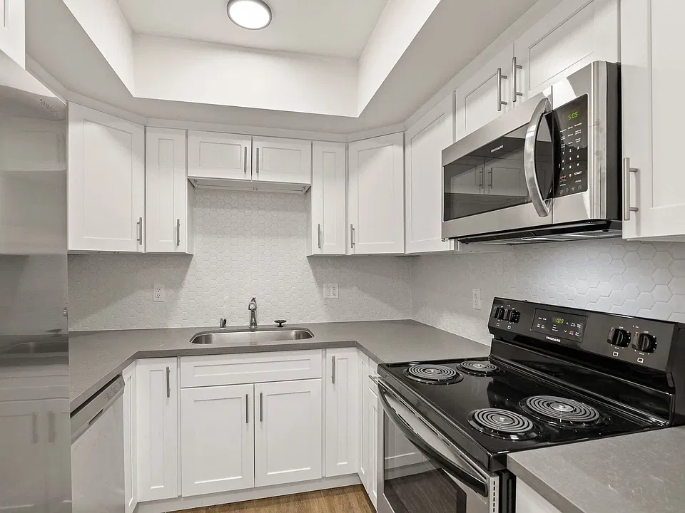 Kitchen with Stainless-Steel Stove and Microwave Oven