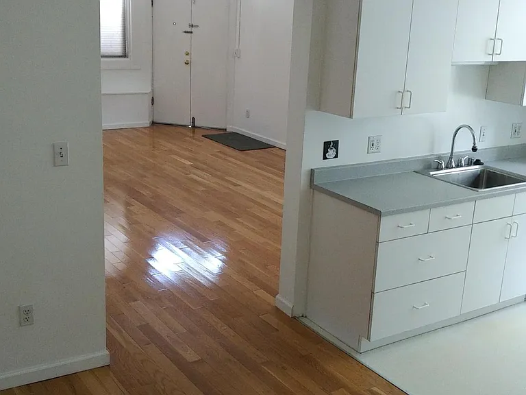 looking north towards dining room (on left) and kitchen (on right) and living room (ahead)