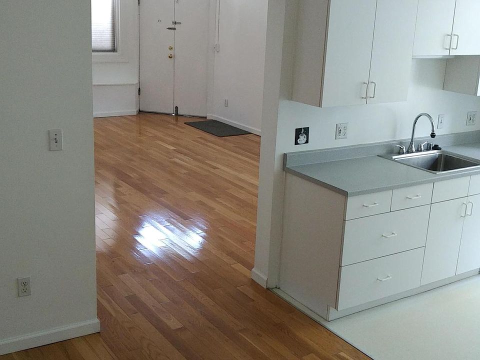 looking north towards dining room (on left) and kitchen (on right) and living room (ahead)