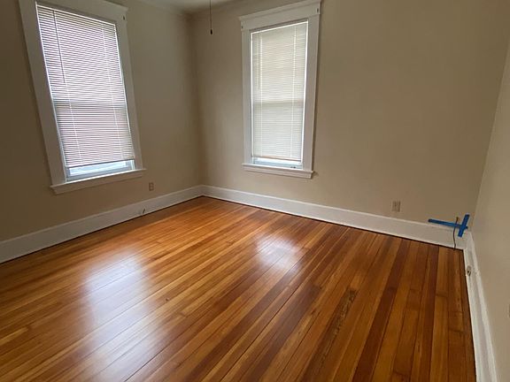 Bedroom with newly-finished hardwood floors