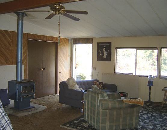 View of one of the wood stoves and living room