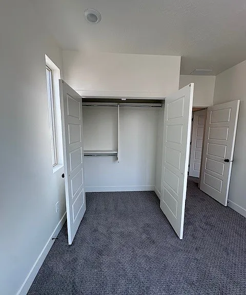 Third bedroom closet with built in shelving.