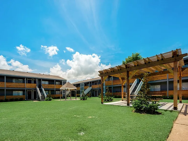 Affordable apartments in Texas City with open green space and courtyard views