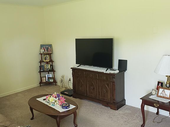 View of Living room from front door. All furniture in these pictures is property of tenant