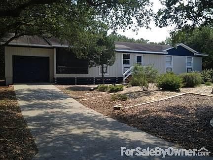 View from Street
						:
						Beautifully and uniquely landscaped with trees, flowers and path.