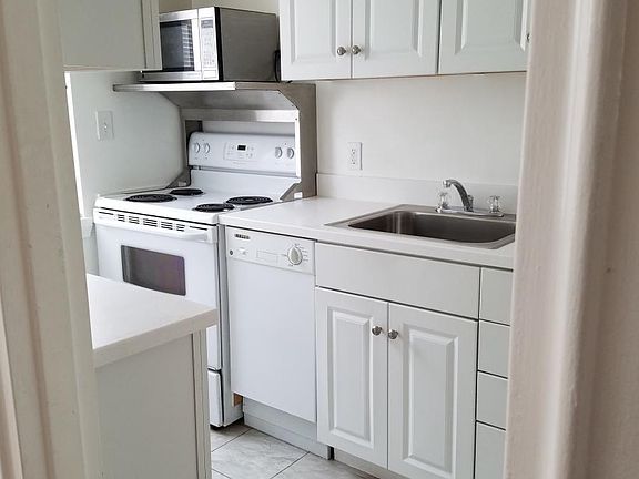 Updated kitchen with new cabinets & corian countertops