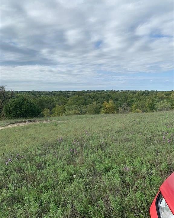 15.36 Acres in Joshua ISD approximately 1 mile from Chisholm Trail Parkway!  Great Trees & some nice level spots for building. BEAUTIFUL