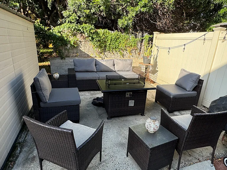 lounge area with fire table and new outdoor furniture