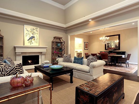 Another view of one of the living rooms sitting areas with fireplace.