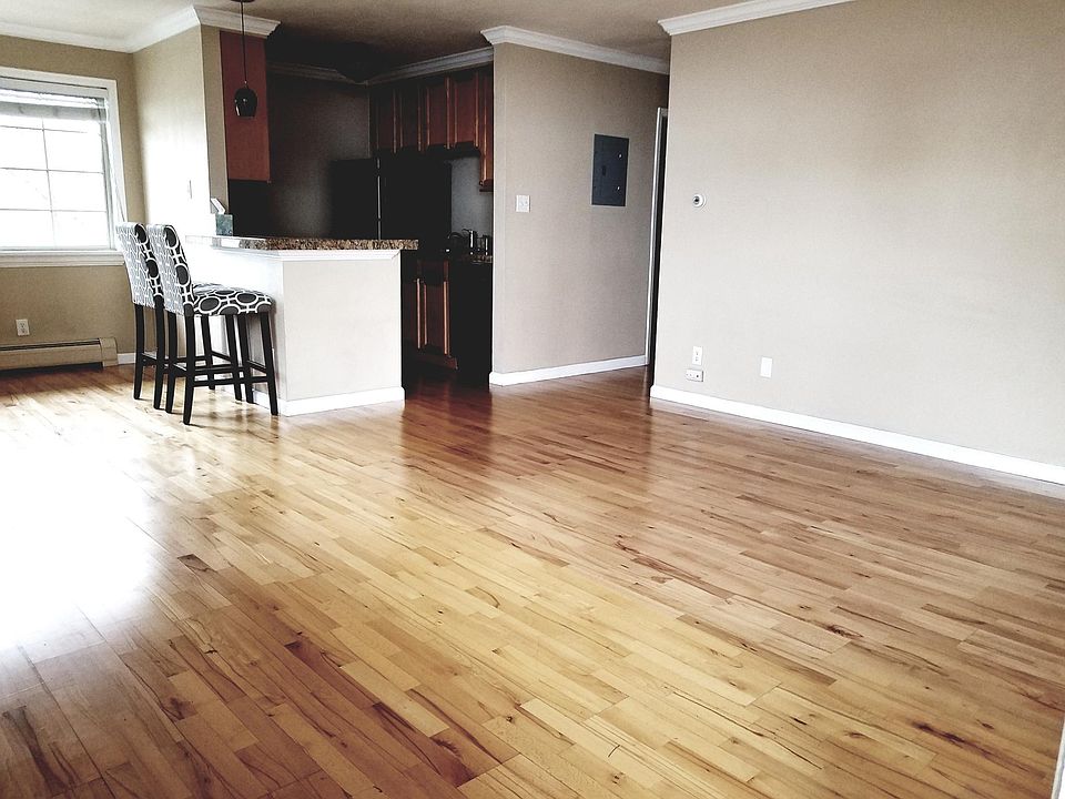 Entry way and living room looking onto the kitchen