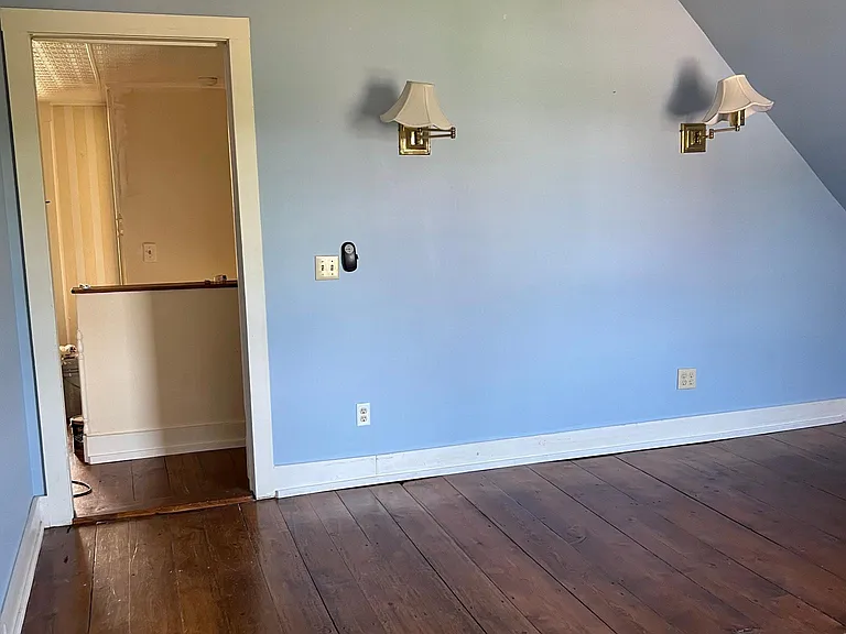 Master bedroom with door to upper hall