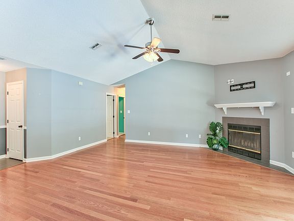Living and hallway to the three bedrooms and two baths.