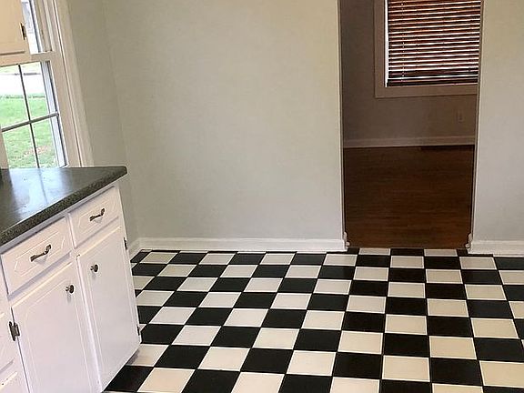  Tiled kitchen with archway 