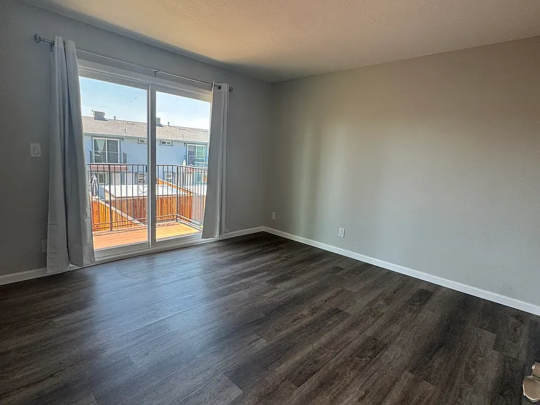 Bedroom #2-Master Bedroom has new plank flooring, slider door has private balcony access.