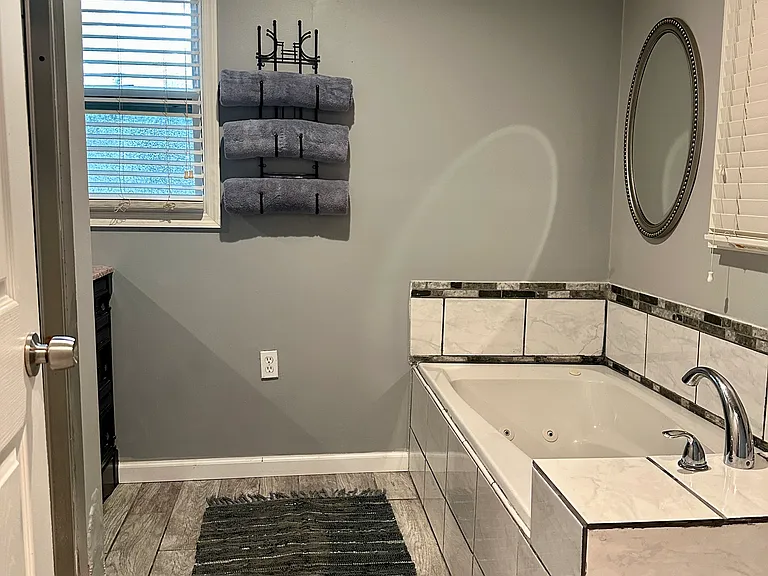 Master bathroom walk in shower, and jet bath tube