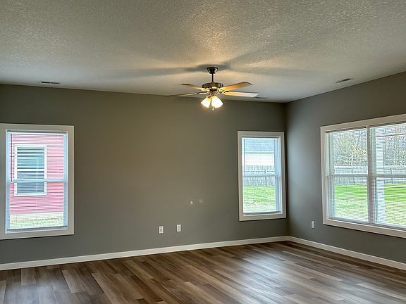 Living room- ceiling fan and vinyl flooring