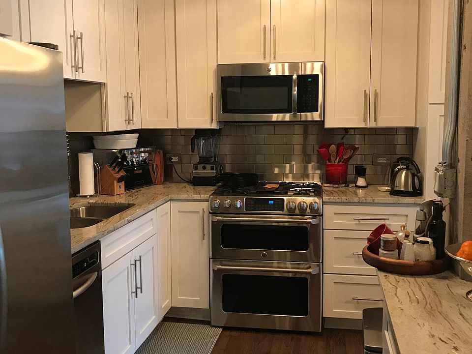 Newly renovated kitchen with granite countertops and stainle