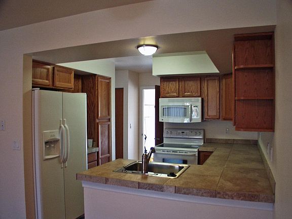 View of the kitchen with the entry into the garage.