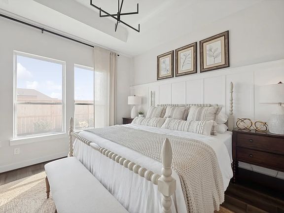 Primary suite with decorative feature wall