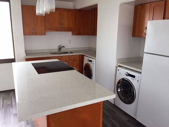 Newly renovated kitchen, new cabinets, island, appliances.