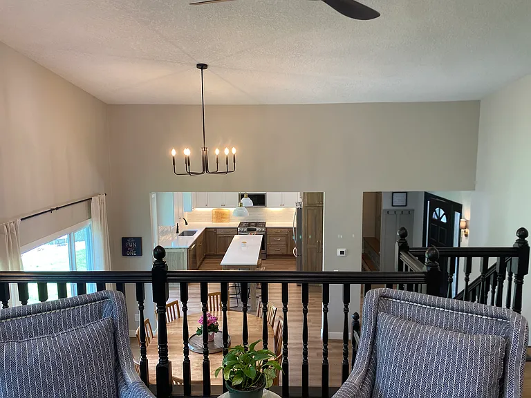 View from formal living, open to kitchen and dining with vault