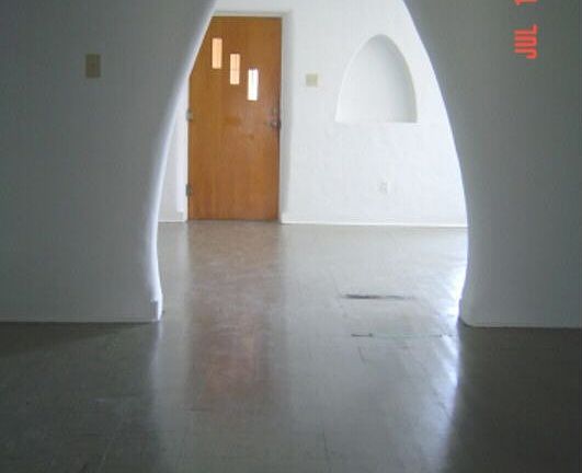 View of front door from dining room