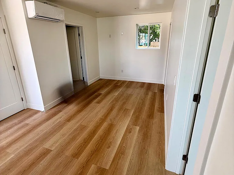 Living Area is open-concept (kitchen is on the other side of this space.) With energy efficient mini-split keeping you warm or cool, as needed for year round comfort.