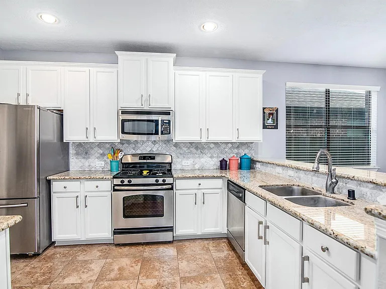 Kitchen featuring a large breakfast bar and open layout