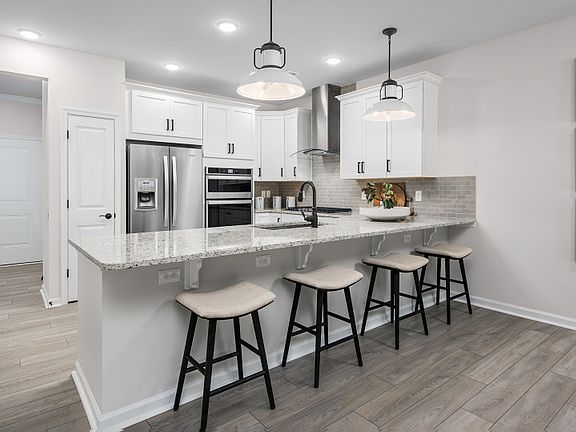 The Gourmet Kitchen Opens to the Cafe and Gathering Room - Perfect for Entertaining