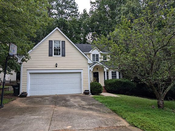 flat driveway w/basketball goal included, large 2 car garage with remote entry (2 car-remotes + keypad at garage)