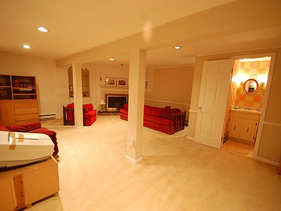 Basement Rec Room - Electric decorative fireplace, powder room, recessed light