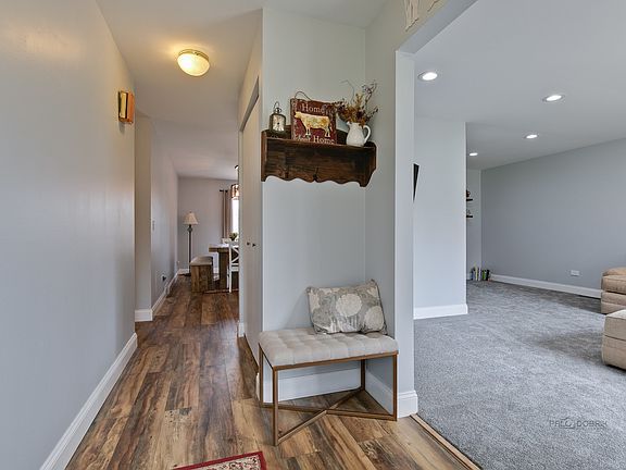 View from front/foyer looking toward down the hall to breakfast room and living room to the right.