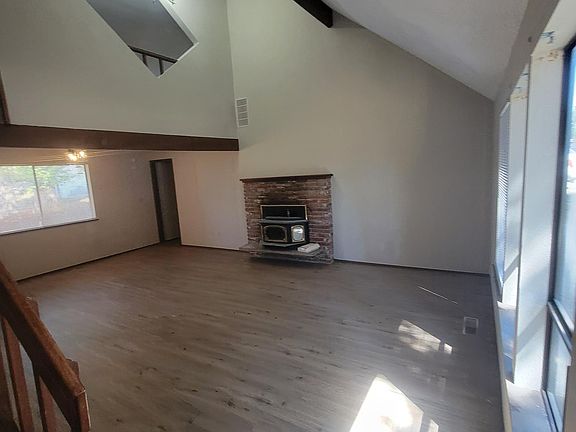 Living area w/ vaulted ceilings