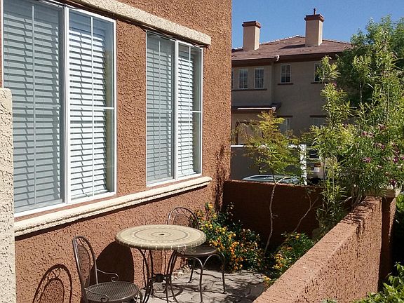 Landscaped patio with bistro table & chairs
