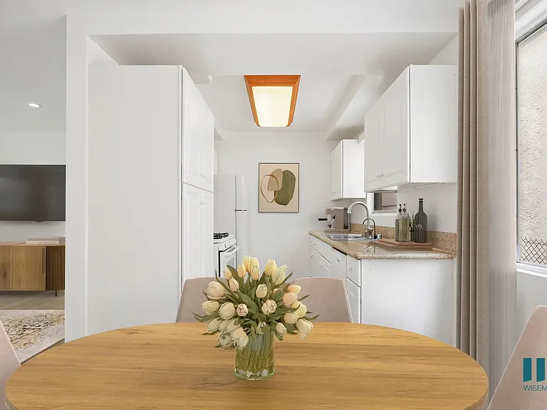 Kitchen with Ample Cabinet Storage and Dining Area