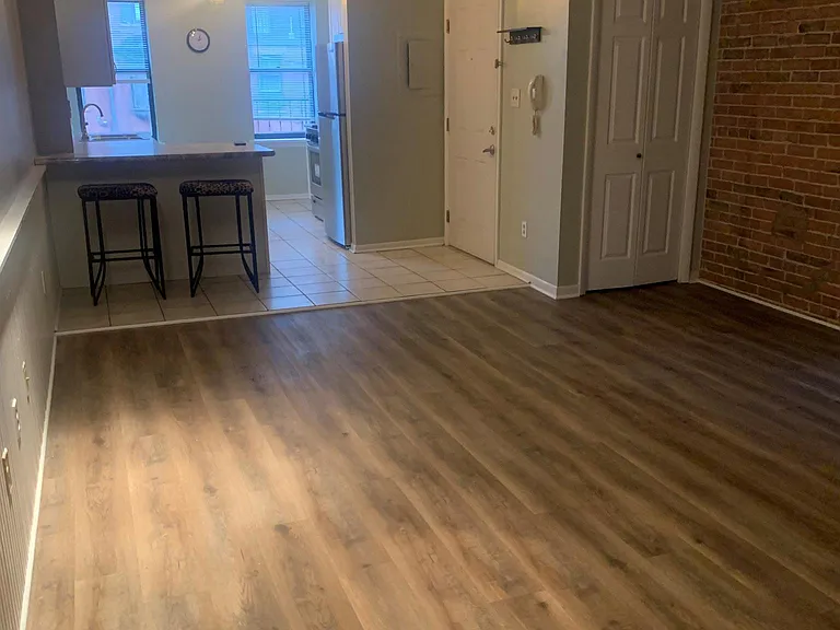 renovated flooring in living room and kitchen